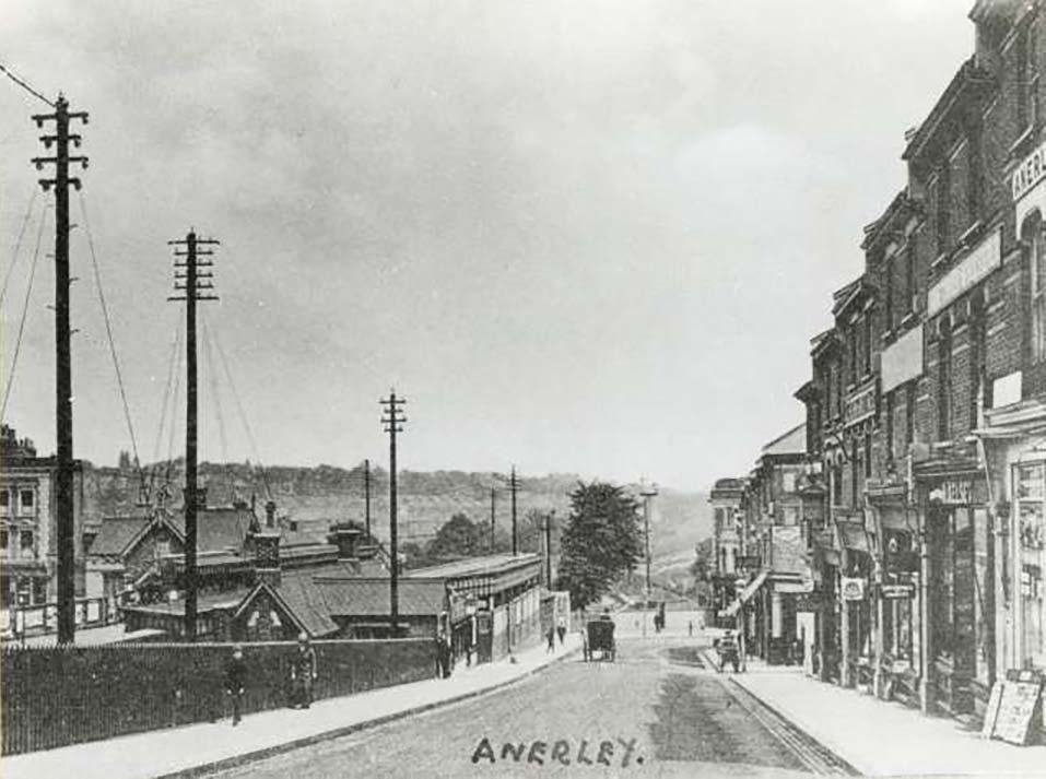 black and white photograph showing a street scene of Anerley Station Road